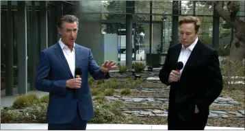  ?? TESLA TWITTER FEED ?? Gov. Gavin Newsom, left, and Tesla Chief Executive Officer Elon Musk appear together in Palo Alto on Wednesday.