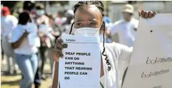  ?? Picture: MARK ANDREWS ?? FIRM MESSAGE: Members of the Buffalo Deaf Associatio­n hosted a silent walk along Oxford Street on Saturday to raise awareness about difficulti­es deaf people experience in society.