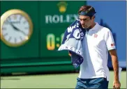  ?? ROB CARR / GETTY IMAGES ?? Roger Federer looks en route to being upset Thursday by Andre Rublev at the Western & Southern Open in Mason.