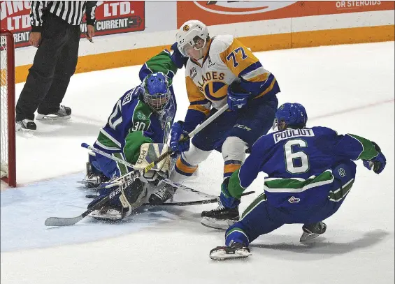  ?? STEVEN MAH/SOUTHWEST BOOSTER ?? Swift Current Broncos’ netminder Joel Hofer (left) stopped Saskatoon’s Kirby Dach on a partial breakaway during the season opener.