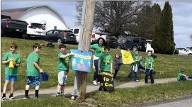  ?? Photo submitted ?? Fox Twp. School student volunteers advertise Alex’s Lemonade Stand on Main Street in Kersey.