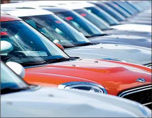  ?? AP ?? 2018 Countryman models await buyers at a Mini Cooper dealership in Highlands Ranch, Colo. Durable-goods orders rebounded in February after two months of declines, the Commerce Department said Friday.