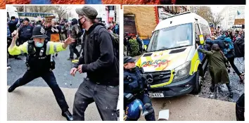  ??  ?? Clash: A police officer armed with a baton tries to ward off a protester. Right, a group of demonstrat­ors attempt to topple a police van covered in graffiti