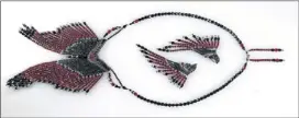  ?? A story in red and black. ?? Austria crystal beads and Czech glass teardrop necklace and earrings, $225, by Robert Hendrix Day Beadwork.