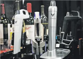  ?? Alex Wong / Getty Images ?? Coravin Wine Preservati­on Openers, which allow pouring wine without removing the cork to preserve wine quality, also have an app.