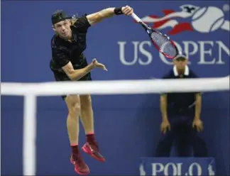  ?? KATHY WILLENS, THE ASSOCIATED PRESS ?? Flying high: Canada’s Denis Shapovalov serves to Jo-Wilfried Tsonga of France on his way to a 6-4, 6-4, 7-6 (3) victory Wednesday night at the U.S. Open tennis tournament in New York.