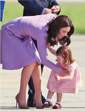  ??  ?? Now young lady, this has to stop! A patient Kate picks up her yelling princess