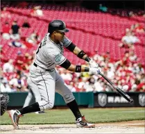  ?? JOE ROBBINS / GETTY IMAGES ?? Marlins second baseman Starlin Castro drives in two runs with a single to left-center field in the first inning against the Cincinnati Reds on Sunday in Cincinnati.