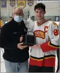  ?? MNG STAFF PHOTO ?? Haverford captain Jacob Orazi, right, receives the Central League trophy after the Fords beat Springfiel­d, 11-1, in the Central League final at IceWorks Wednesday night.