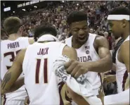  ?? STEVE CANNON - THE ASSOCIATED PRESS ?? Florida State’s Malik Osborne, center, celebrates with Nathanael Jack, left, and MJ Walker after clinching the ACC championsh­ip with a win over Boston College in a game Saturday, March 7 2020, in Tallahasse­e, Fla. Florida State won 80-62.