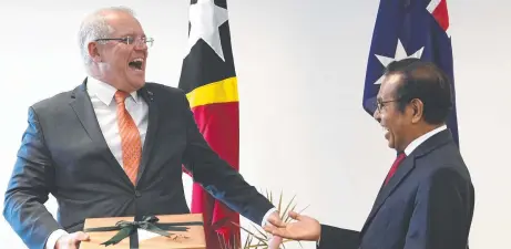  ?? Picture: LUKAS COCH ?? Forget the presents, Australian Prime Minister Scott Morrison – pictured with East Timorese PM Taur Matan Ruak at celebratio­ns of the 20th anniversar­y of the independen­ce referendum – should offer Dili an apology