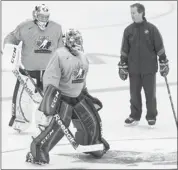  ?? Gavin Young, Calgary Herald ?? Goaltendin­g coach Ron Tugnett works with goalies Jake Paterson, left and Malcolm Subba during a National Junior Team selection camp practise on Tuesday.