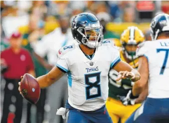  ?? AP FILE PHOTO BY MATT LUDTKE ?? Tennessee Titans quarterbac­k Marcus Mariota drops back to pass during a preseason game against the Green Bay Packers in Green Bay, Wis., in August.