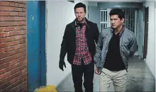  ?? STX ENTERTAINM­ENT ?? Mark Wahlberg and Iko Uwais in "Mile 22."