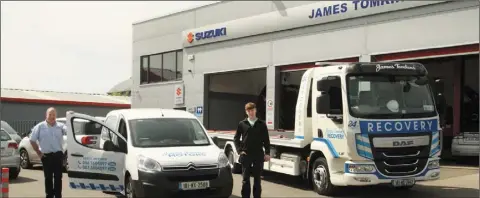  ??  ?? Proprietor, James Tomkins and his son, Seamus Tomkins with their service van and recovery truck.