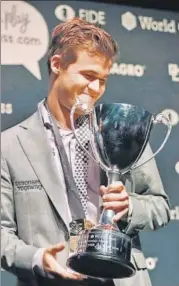  ?? AFP ?? Norway's Magnus Carlsen is all smiles after defending the world chess title for the third time in London on Wednesday.