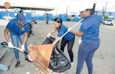  ??  ?? Kingston Wharves Limited, led by its Millennial Club, engaged in a clean-up exercise in sections of the Newport West community.