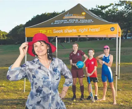  ?? Picture: Shae Beplate ?? Skin Repair Skin Cancer Clinic medical director Helena Rosengren with Mia Brooks, Riley Johnston and Mala Brooks showing off one of the marquees up for grabs.