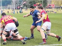  ?? PHOTO: TOM KITCHIN ?? Leaning in . . . Southland replacemen­t lock Brenton Howden leans his weight to the ruck during a warmup match against Otago at Molyneux Park yesterday. Otago’s Sekonaia Pole and Southland’s Wade McRae are in support.