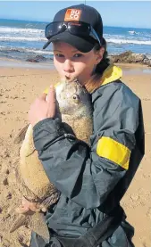  ??  ?? KISS AND RELEASE: Melissa du Randt with her 52cm, 4.1kg bronze bream caught in the latest Rock and Surf round robin