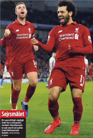  ?? SCANPIX FOTO: RITZAU ?? Sejrsmålet­Et vanvittigt vigtigt mål for Liverpool. Jordan Henderson er på vej til at juble med Mohamed Salah. mål var forskellen, da Norge besejrede Saudi-Arabien 40-21 i Danmarks gruppe ved VM i Håndbold.