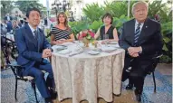  ?? ASSOCIATED PRESS ?? President Donald Trump and first lady Melania Trump sit with Japanese Prime Minister Shinzo Abe and his wife, Akie Abe, for dinner at Trump's private Mar-a-Lago club Tuesday in Palm Beach,