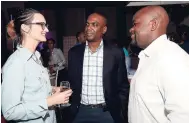  ??  ?? Stanley Motta’s Melanie Subratie, has the full attention of Claude Duncan of JAMPRO (centre) and Andre Dennis of FLOW.