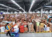  ?? PROVIDED TO CHINA DAILY ?? A worker prepares goods at a warehouse in Shenyang for online orders, to be dispatched to buyers nationwide.