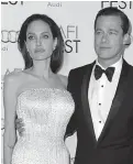  ?? Associated Press ?? ■ Angelina Jolie, left, and Brad Pitt arrive at the 2015 AFI Fest opening night premiere of "By The Sea" in Los Angeles. Jolie Pitt says she wants her divorce from Brad Pitt finalized before the end of the year, and that she intends to seek retroactiv­e child support.