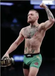  ??  ?? In this Nov. 9 photo, Conor McGregor gestures toward fans while working out at Madison Square Garden in New York. Boxer Floyd Mayweather Jr. said Wednesday he will come out of retirement to face UFC star Conor McGregor in a boxing match on Aug. 26.