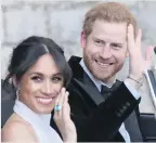  ??  ?? Harry appeared to have given his bride a poignant wedding day gift — an emeraldcut aquamarine ring that belonged to his late beloved mother, Princess Diana.
Meghan was spotted with the large gem on her right hand (above) as the couple made their way...