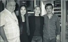  ?? PROVIDED TO CHINA DAILY ?? From left: English engineer Haydn Bendall, Chinese singer-songwriter Ding Wei, American singer-songwriter Suzanne Vega and producer Lin Chaoyang at Metropolis Studios in London.