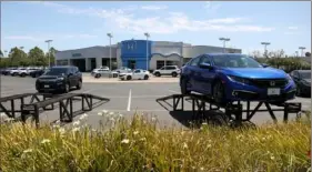  ?? Justin Sullivan/Getty Images ?? The sales lot at Marin Honda is nearly empty earlier this month in San Rafael, Calif. The global microchip shortage continues to impact the automobile supply chain, helping drive a surge in car repairs, as people try to keep their current cars going as long as possible.