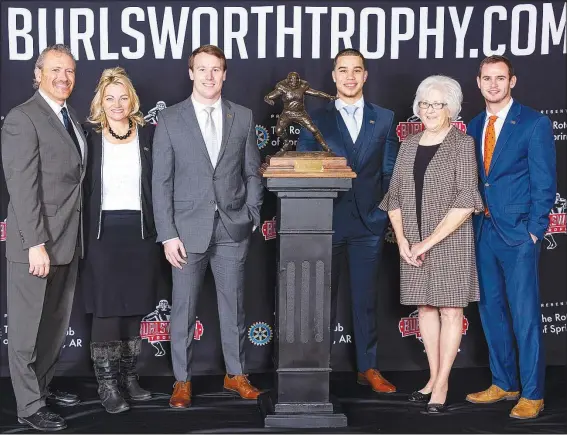  ?? Courtesy Photo ?? Marty and Vickie Burlsworth (from left), Patrick Laird, Marcus Epps, Barbara Burlsworth and Hunter Renfrow stand for a photo at the Burlsworth Trophy luncheon and presentati­on ceremony Dec. 3 at the Northwest Arkansas Convention Center in Springdale. Renfrow was named the 2019 trophy winner at the luncheon.
