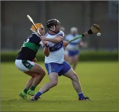  ??  ?? Gerry Connors clears this ball despite the efforts of Bray’s Davy Maloney in Aughrim on Sunday evening.