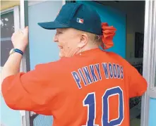  ?? GREG SORBER/JOURNAL ?? Mary Sarty wears a jersey with her father’s name on the back. Pinky Woods was a pitcher for the Boston Red Sox in the 1940s.