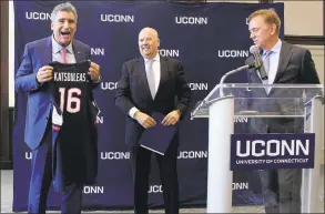  ?? Pat Eaton-Robb / Associated Press file photo ?? Thomas C. Katsouleas, left, is presented with a UConn basketball jersey by University of Connecticu­t Board of Trustees chairman Thomas Kruger, center, and Gov. Ned Lamont after being appointed as the University of Connecticu­t’s 16th president in February in Storrs.