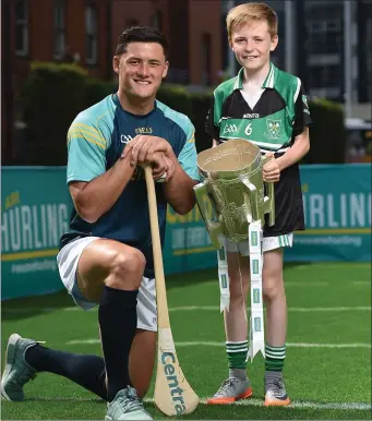  ??  ?? Lee Chin at the #WeAreHurli­ng launch with ten-year-old Wexford supporter Tadgh Rowe from Kilmore.