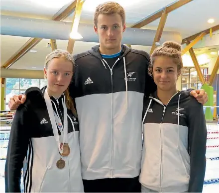  ??  ?? Kiana Swain, left, Zac Dell and Tavarnya Howe from the Pukekohe Swimming Club.