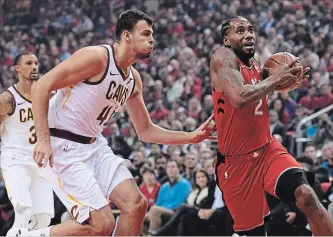  ?? NATHAN DENETTE THE CANADIAN PRESS ?? Raptors’ Kawhi Leonard (2) moves pass Cleveland Cavaliers’ Ante Zizic (41) during first-half NBA action in Toronto on Wednesday night. For the game result and more NBA news, see therecord.com.