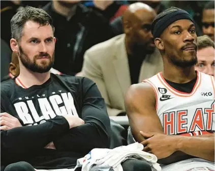  ?? AARON GASH/AP ?? The Heat already have given Jimmy Butler, right, a level of support on the NBA buyout market with the addition of Kevin Love, left.