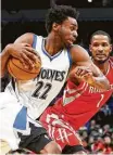  ?? Jim Mone / Associated Press ?? The Timberwolv­es’ Andrew Wiggins, who had 28 points, takes off against Trevor Ariza.