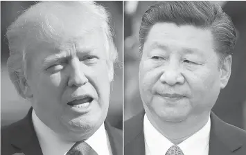  ?? (AP PHOTO) ?? Trump and Xi