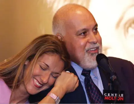  ?? PAUL CHIASSON/THE CANADIAN PRESS ?? Singer Céline Dion leans on her husband René Angélil’s shoulder as he responds to a question during a news conference in Montreal in 1999. It was Angélil’s first public appearance after undergoing cancer treatments. He died Thursday, aged 73.