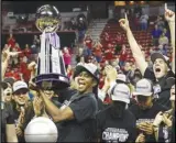  ?? Associated Press ?? UNLV’s Desi-Rae Young (center) celebrates her team’s 71-60 win against Wyoming in the Mountain West tournament championsh­ip game, Wednesday, in Las Vegas. Young was named MVP.