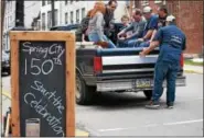  ?? MARIAN DENNIS — DIGITAL FIRST MEDIA ?? Band members load into the back of a pickup truck on Main Street to take them to their first destinatio­n for the “Sesquisere­nade.” The event was part of the kickoff for the sesquicent­ennial of Spring City.