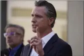  ?? DAMIAN DOVARGANES — THE ASSOCIATED PRESS ?? Gov. Gavin Newsom takes questions from the media after a visit to a COVID-19vaccine clinic at the VA Greater Los Angeles Healthcare System in Los Angeles on Wednesday.