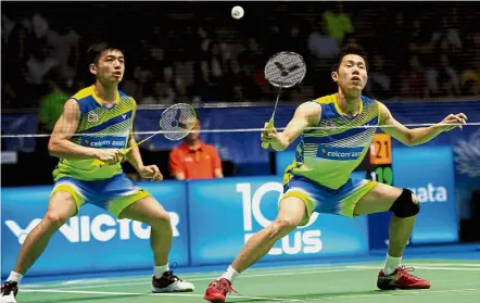  ??  ?? Step it up: Goh V Shem (right) and Tan Wee Kiong are leading Malaysia’s charge in the men’s doubles at the World Badminton Championsh­ips in Glasgow.