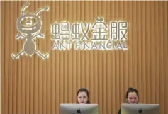  ??  ?? Employee sit under the logo of Ant Financial Services Group, Alibaba’s financial affiliate, at its headquarte­rs in Hangzhou, Zhejiang province, China. — Reuters photo