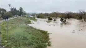  ?? Photograph: Twitter @BobbieGren­nier/Bobbie Grennier/Reuters ?? The Pajaro River, in a central California community known for strawberry farming, overflowed its banks as authoritie­s urged residents to evacuate.